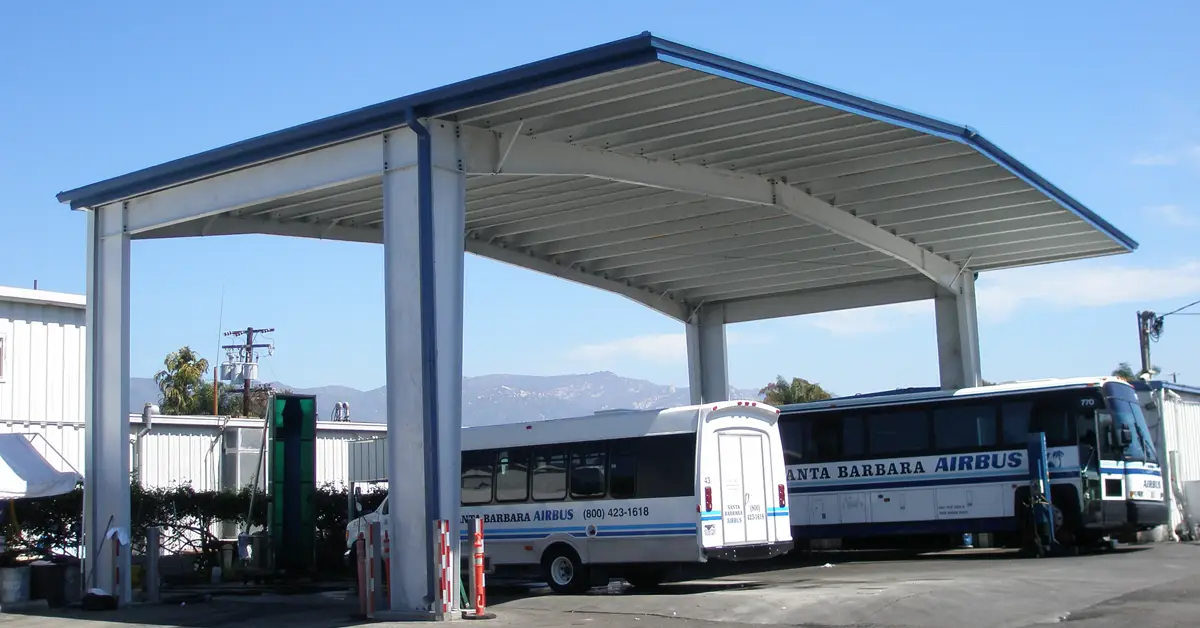 Heavy-Duty Canopies and Shelters by FCP. Featured image of industrial steel canopy over large transport buses